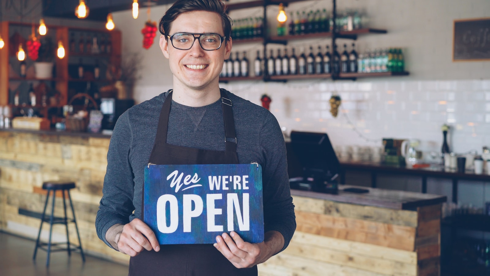 Shopkeeper opening up for the day