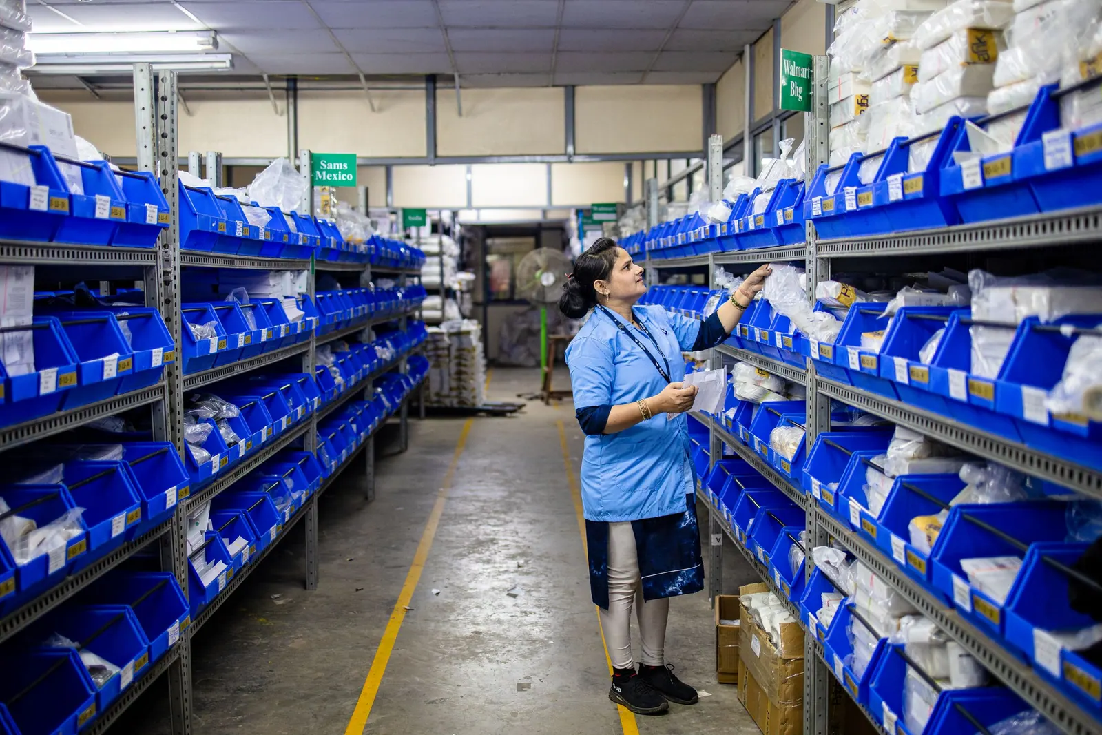Rows of storage shelving in a production and distribution warehouse